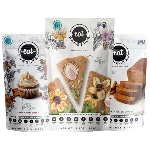Three packages of 'eat Gangster' baking mixes on a white background